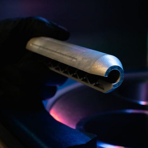 3D-printed silencer in titanium (backside) with 2Create